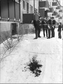 Police at the scene where the woman in 40s shot by her husband. Blood Trails visible in the snow. - Vintage Photograph