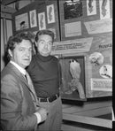 Two men watching the endangered peregrine falcon at the National Museum's exhibition "Living with Nature" - Vintage Photograph