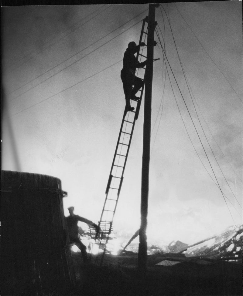 Firemen had to take up the leadership post to break the current during an explosive fire occurred at an animal farm - Vintage Photograph