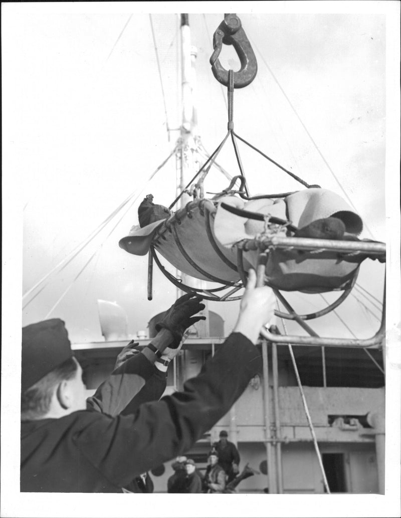 The explosion accident in Ålandstankern Bonny. The injured were landed by means of lift cranes - Vintage Photograph