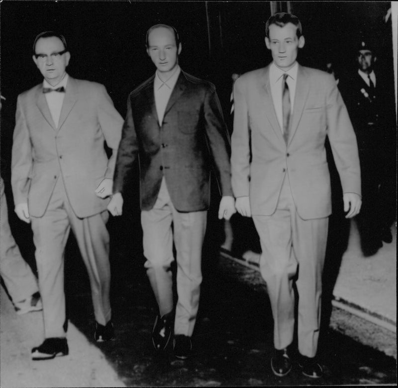 The murder suspect Leonard Pettersson is brought to the police station in Östersund by two detectives - Vintage Photograph