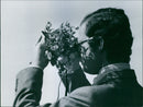 King Carl XVI Gustaf views the bird life with a binoculars in HjÃ¤lstavikens nature reserve during his Eriksgata 1974 - Vintage Photograph