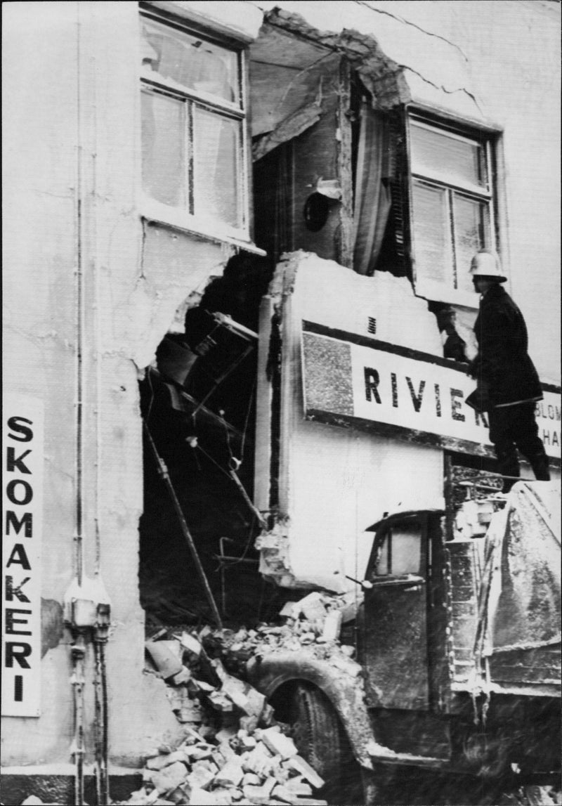 During the difficult snowfall in Sundsvall, a truck slipped onto the sidewalk and continued straight through a house wall - Vintage Photograph