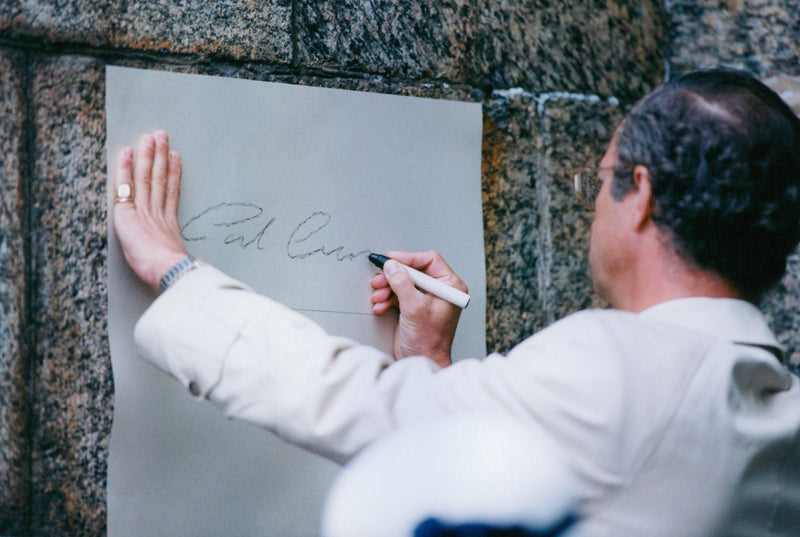 King Carl XVI Gustaf writes signature at Eriksgata in Vaxholm - Vintage Photograph