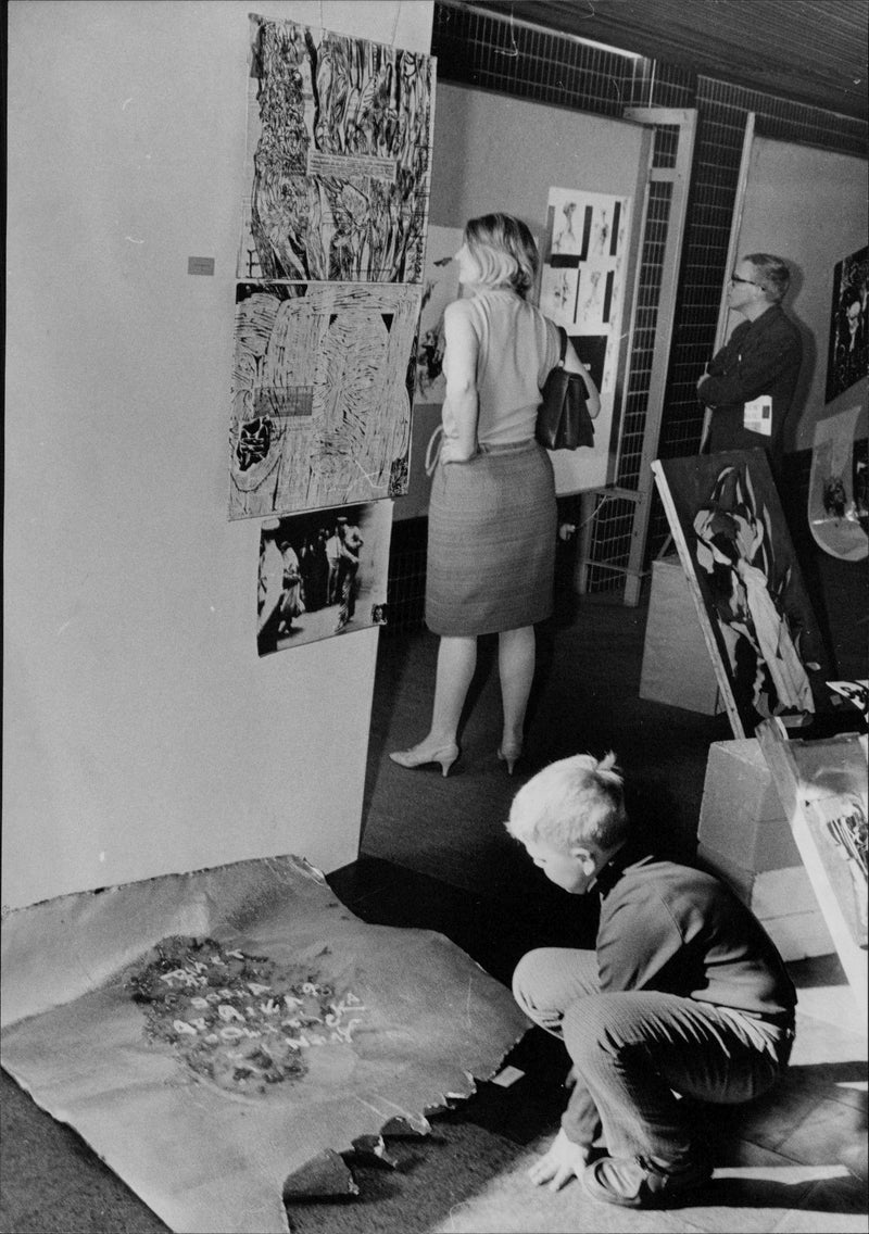 A little boy is studying a symbolic collage representing Africa&