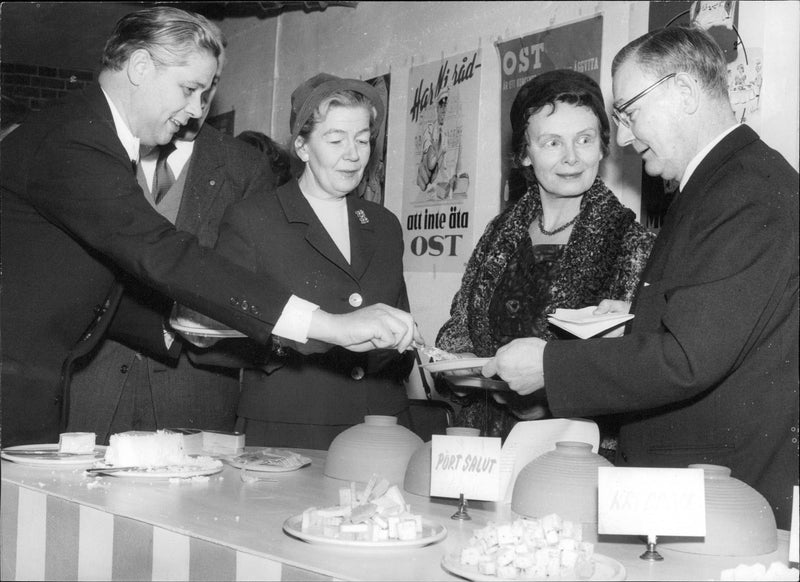 Rune Lofgren and Signature Bergman gives Anna Lisa Lyberg and Ingrid Bergquist taste of national agricultural meeting future cheeses. - Vintage Photograph
