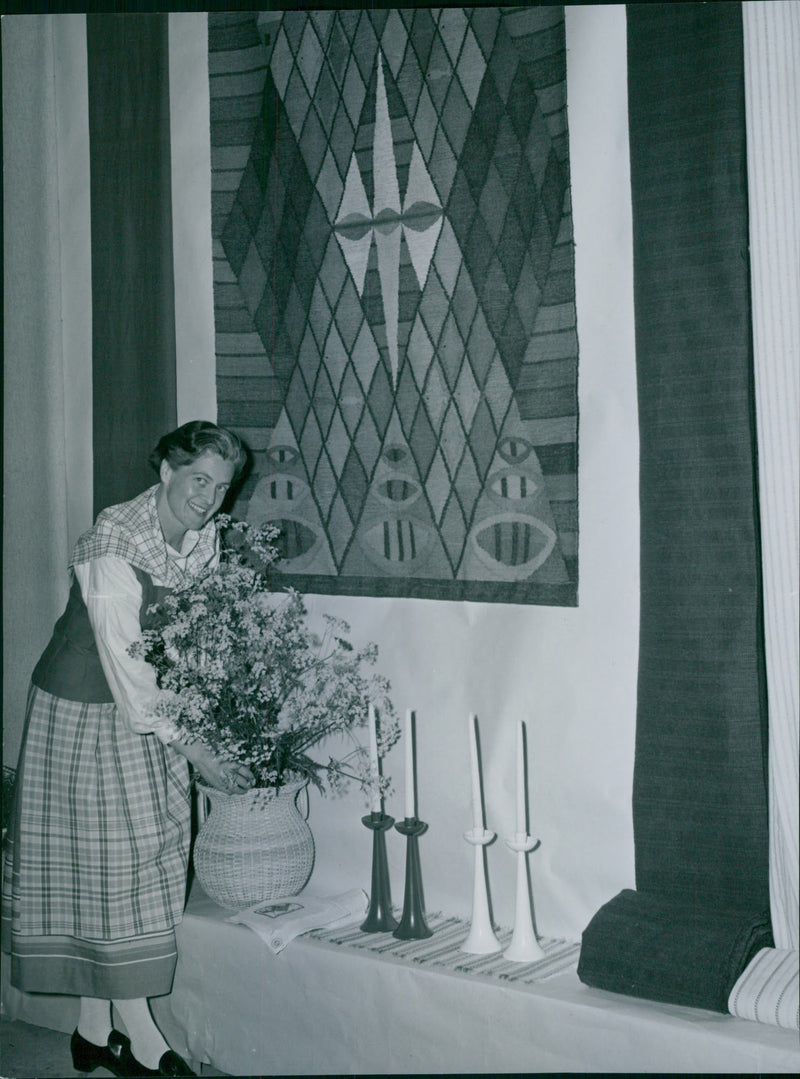 Nina von EngestrÃ¶m in the new vÃ¤ddÃ¶ costume make farming meeting exhibition opening clear. Tapestry Inger Emanuelsson's "Fishing Village". - Vintage Photograph