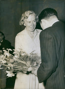 Elsa EwerlÃ¶f thanked with flowers at Stockholm right's Annual General Meeting at the Concert Hall. - Vintage Photograph