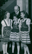 Estonian minister H. Laratei with some nationally dressed little singers at the 30th anniversary of Estonia&