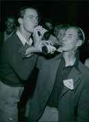 Klas RunstrÃ¶m and John Murphy drink Pommac during English-Swedish poetry in Sigtuna - 31 July 1946 - Vintage Photograph