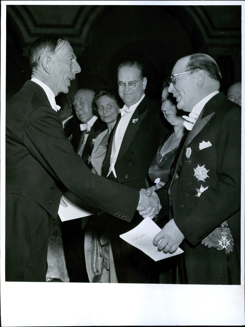 Prince William shaking hands with KA Fagerholm in the company of Aina Erlander and Johan Nilsson of the Swedish Finnish unions' Association soiree. - Vintage Photograph