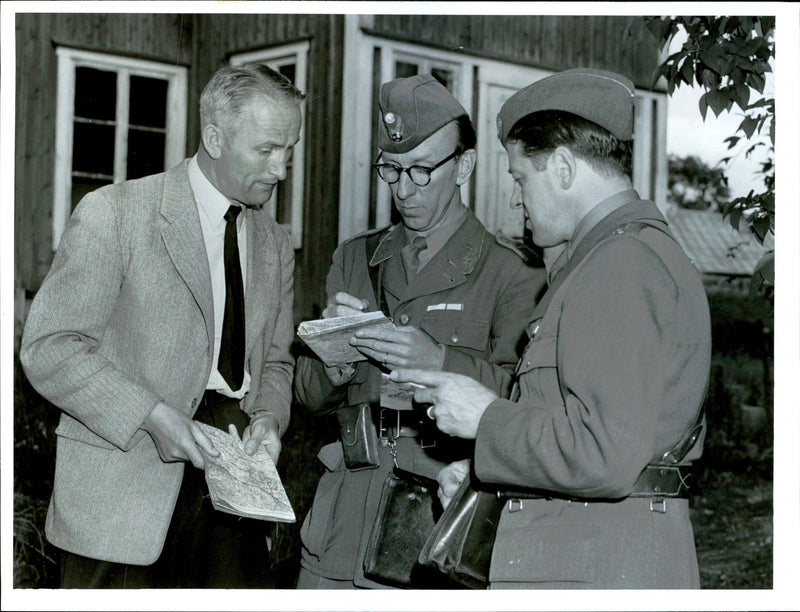 Military studying the map. - Vintage Photograph