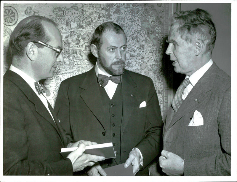 Tourist Association party where among other things, writers participated. From left filr.dr. Dahlbeck, artist Svensson and Ph.D. Anrick attended the party. - Vintage Photograph