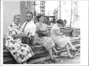 Mrs. Matvejevskaya, Opolovnikov Mr., Mrs. and Mrs. Dukelskaya Tishkina take a little break after the tour - Vintage Photograph