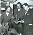 Selma Jacobson of Chicago shows people superintendent Robert Wenngren and seminary teacher Sven Green a Neolithic landscape which children in third grade made - Vintage Photograph