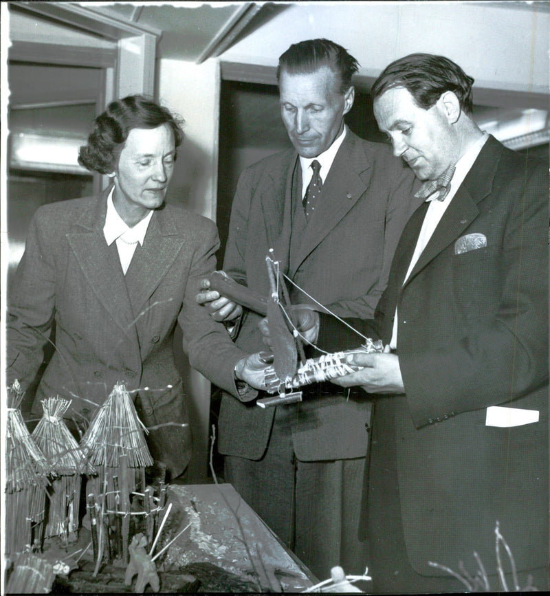 Selma Jacobson of Chicago shows people superintendent Robert Wenngren and seminary teacher Sven Green a Neolithic landscape which children in third grade made - Vintage Photograph