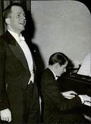 Jur. BCs. StyrbjÃ¶rn Hybbinette sing on the stage of the Stockholm Concert Hall at the start of hÃ¤lsokampanejn - 27 February 1945 - Vintage Photograph
