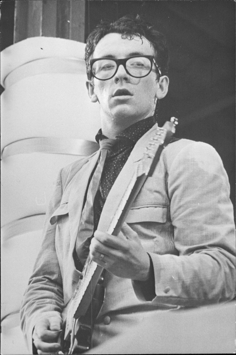 Elvis Costello plays guitar - Vintage Photograph