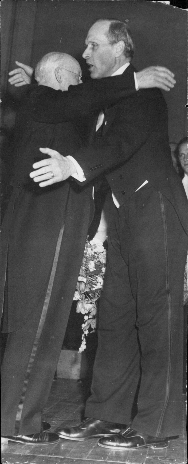 Hugo AlfvÃ©n being courted after the concert in the Concert Hall of the file. Dr. Brother Jonzon with flower bouquet and embrace - 28 April 1947 - Vintage Photograph