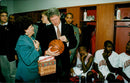 Bill Clinton writes autograph on a basketball - Vintage Photograph