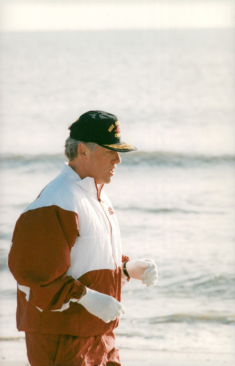 Bill Clinton takes a springtur on the beach - Vintage Photograph