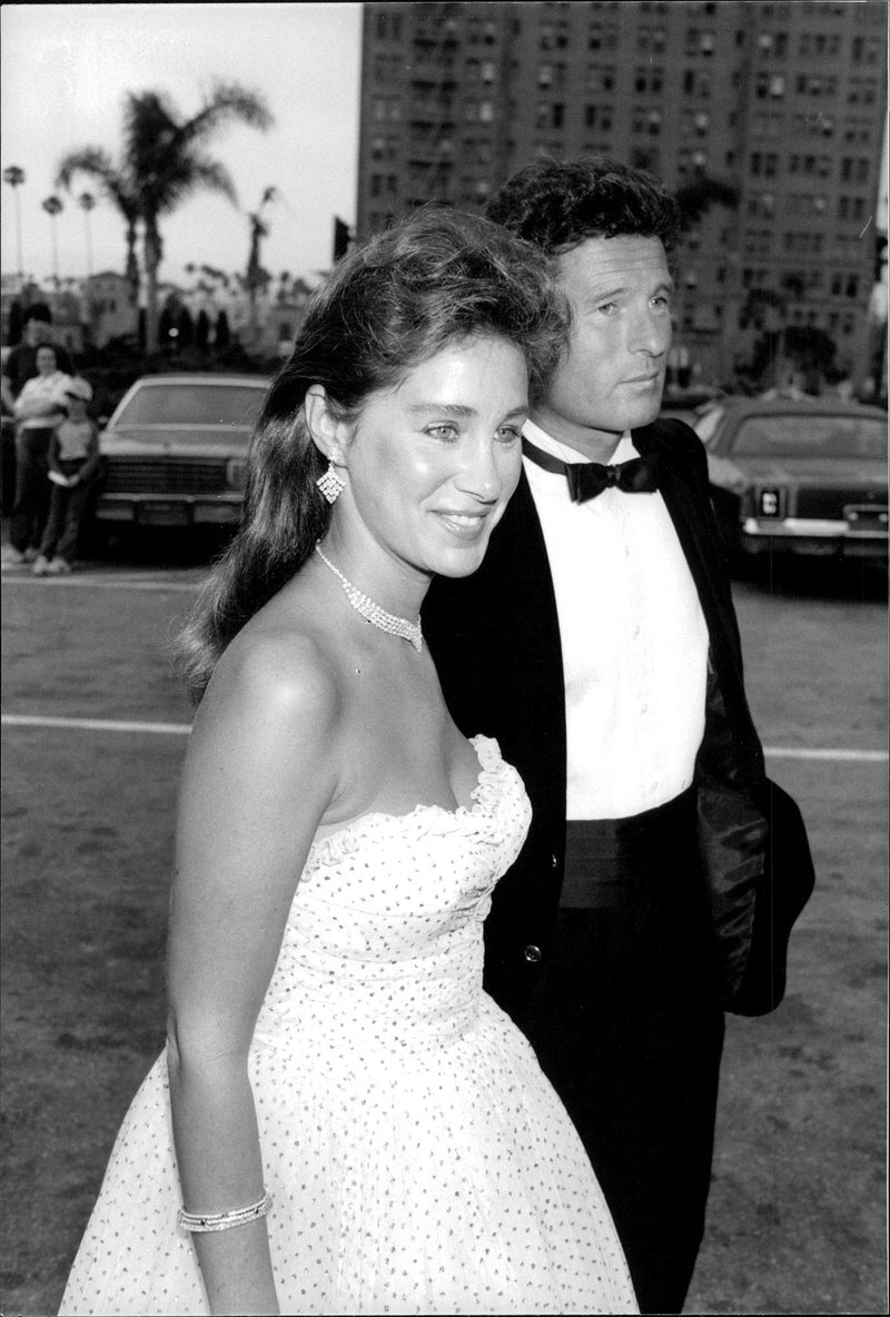 Actress Pamela Bellwood and her husband, the British photographer Nik Wheeler at a party in Los Angeles. She played Claudia Blaisdell of "Dynasty." - Vintage Photograph