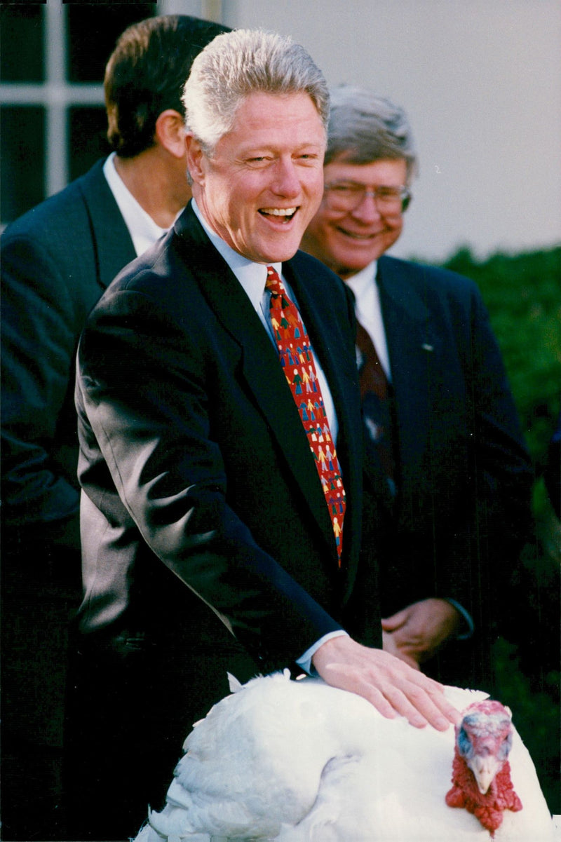 Bill Clinton chooses his turkey to the family. - Vintage Photograph