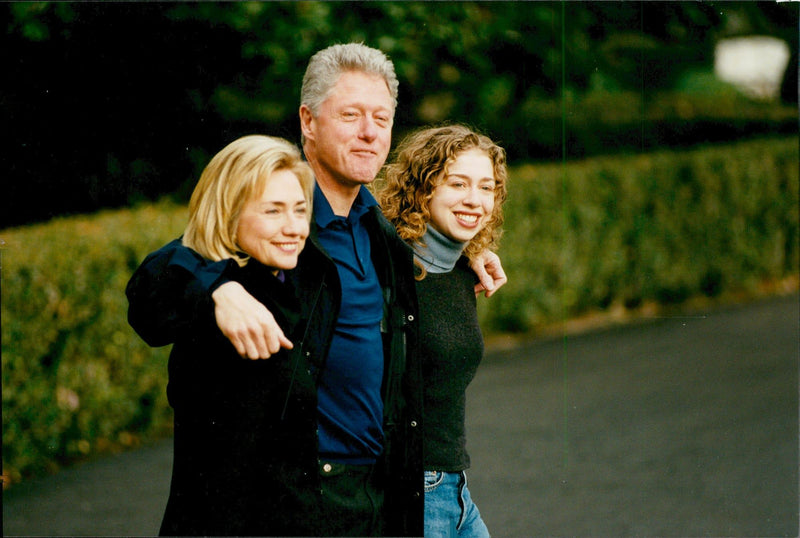 Bill Clinton with his wife Hillary and daughter Chelsea on their way to celebrate Thanksgiving - Vintage Photograph