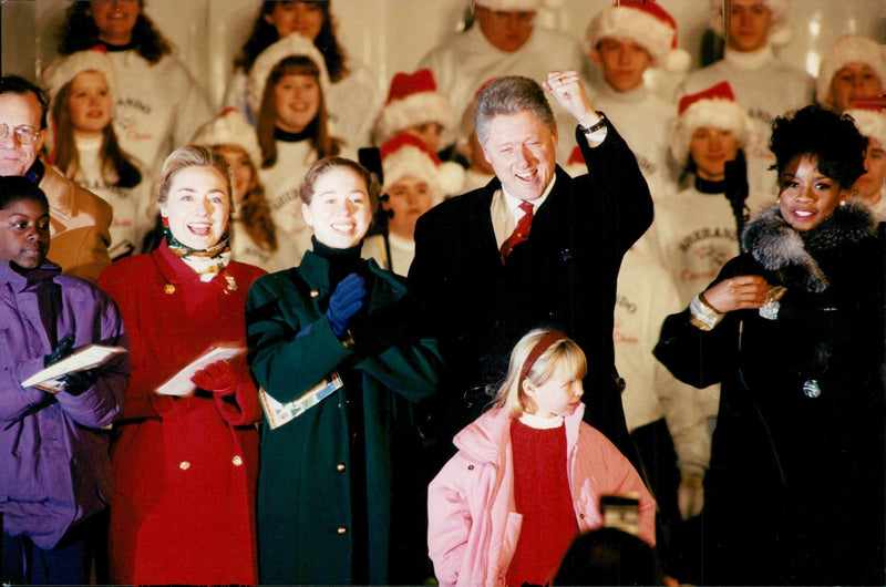 Bill Clinton's wife Hillary and daughter Chelsea were by and lighted Christmas tree this year - Vintage Photograph