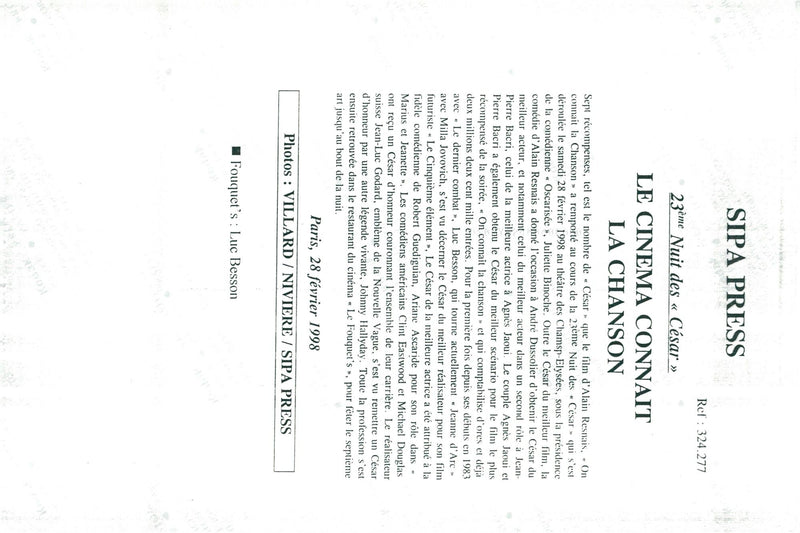 Regisseur Luc Vesson is proud of his award while a quartet musician is playing around him. - Vintage Photograph