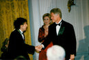 President Bill Clinton shakes hands with Bod Dylan at an awards ceremony at the Kennedy Center - Vintage Photograph