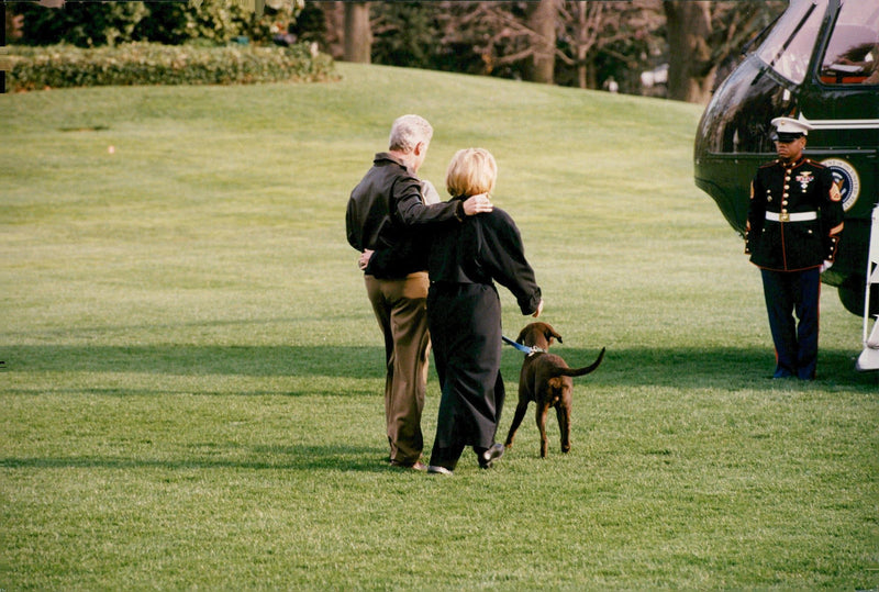 Bill and Hillary Clinton walking the family dog - Vintage Photograph