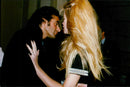 A hug behind the scenes between David Copperfield and Claudia Schiffer at the Chanel fashion show in Paris - Vintage Photograph