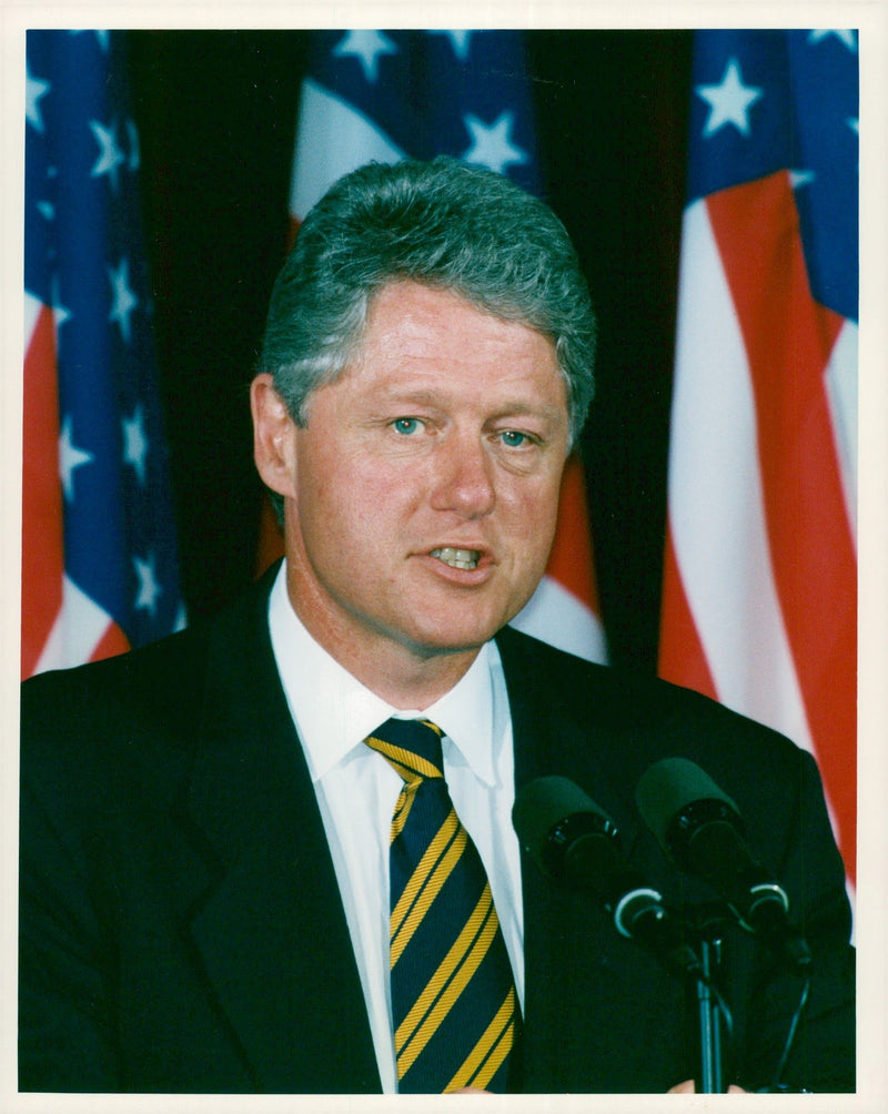 President Bill Clinton holds - Vintage Photograph