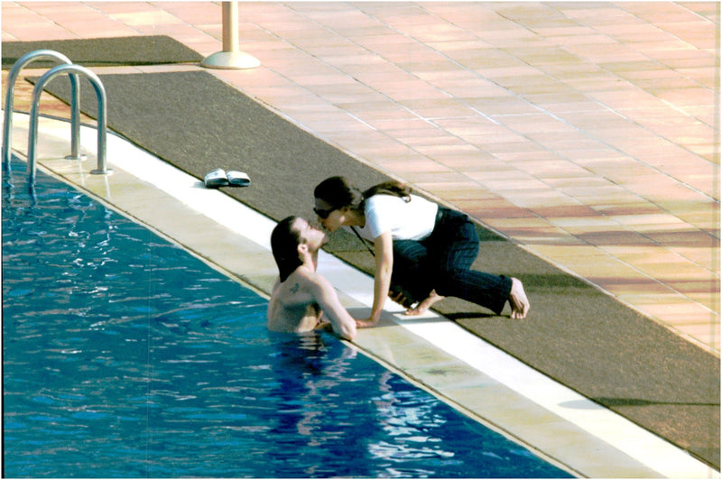 Emanuele Filiberto take a dip in the pool and kissing his fiancÃ©e Alejandra di Andia - Vintage Photograph