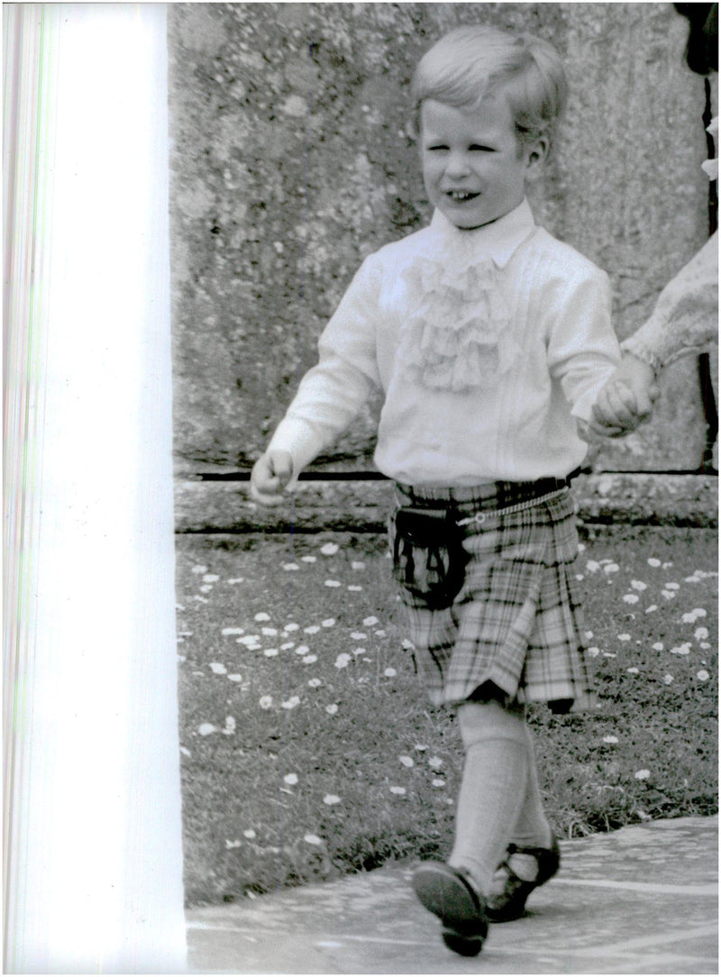 Princess Anne and Mark Phillips's son Peter Phillips in a Royal Stewart Tartan kilt on the way to Aunt Sarah Phillips wedding - Vintage Photograph