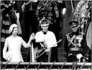 Queen Elizabeth II presents her son, Prince Charles of Wales, outside Caernarfon Castle. - Vintage Photograph