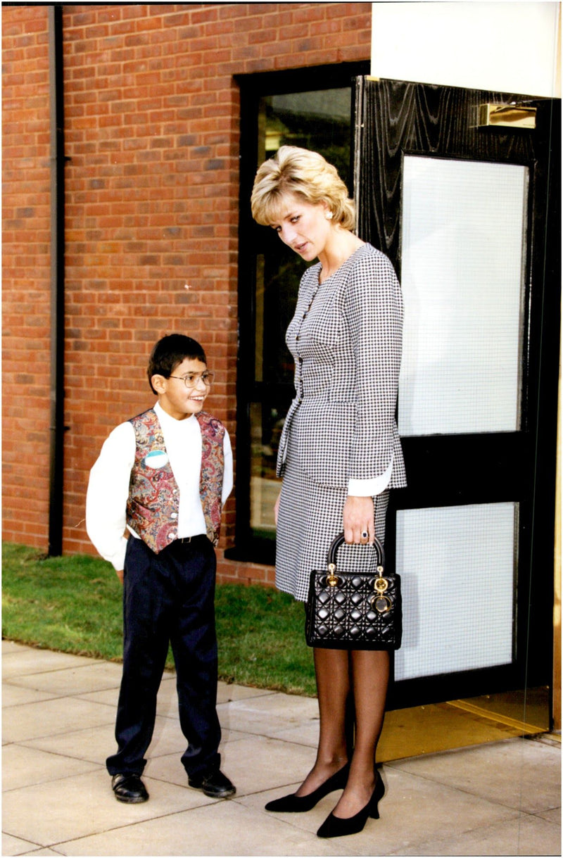 Princess Diana is shown around at the Institute of Conductive Education of 10-year-old Laurence Chambers - Vintage Photograph