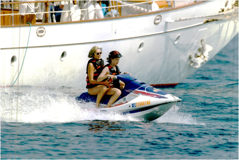 Princess Diana runs watercraft during her French Riviera vacation. - Vintage Photograph