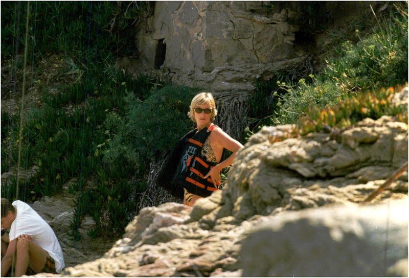 Princess Diana enjoys a holiday at the French Riviera and tries to hide from the paparazzias. - Vintage Photograph