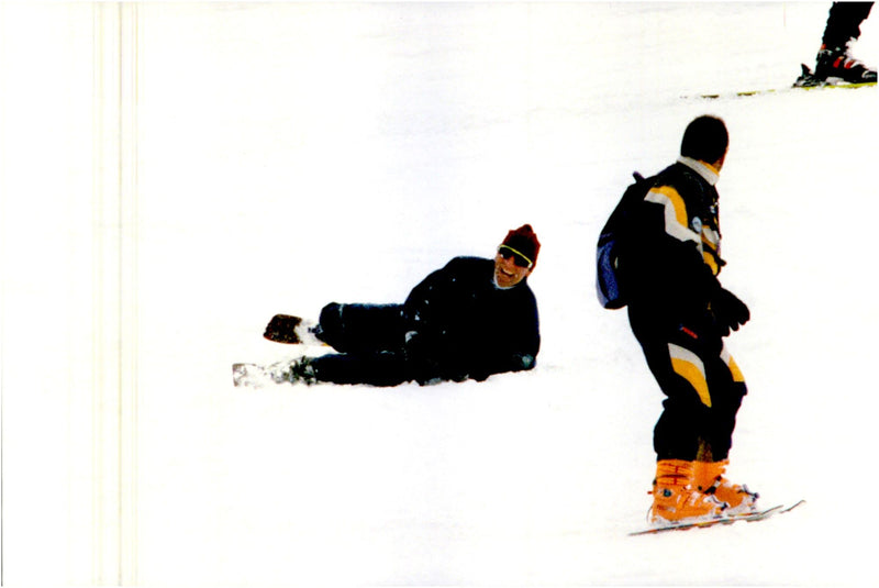 Prince Charles falls in the ski slope on Holidays in the Alps - Vintage Photograph