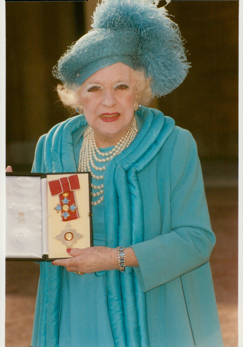 Barbara Cartland shows off her medals - Vintage Photograph