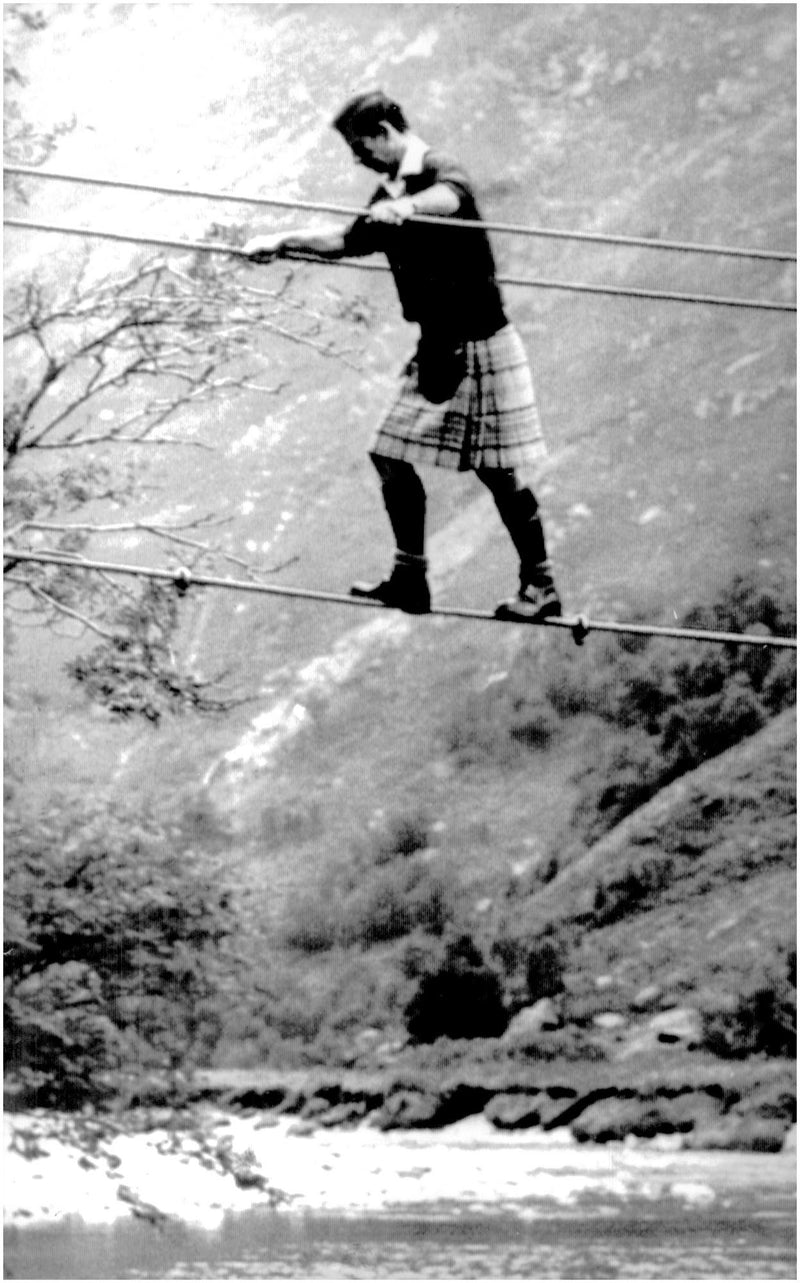 Prince Charles wearing a kilt practicing balance on a rope - Vintage Photograph