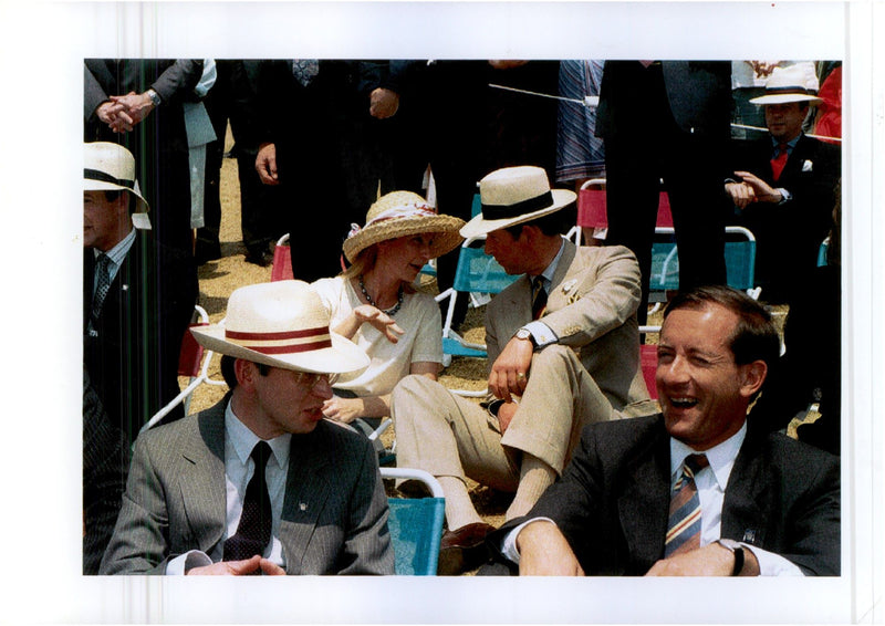 Prince Charles in conversation with a woman during an event. - Vintage Photograph