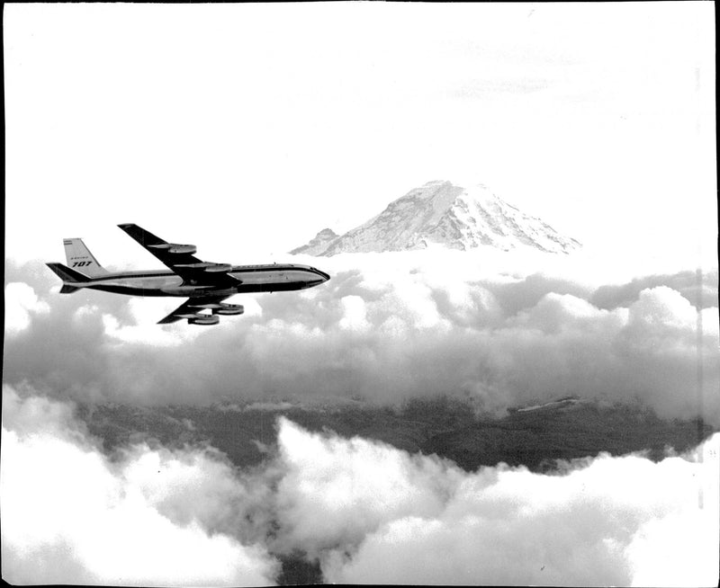 Gripen with the first Boeing 707 Stratoliner above Seattle with "city mountain" Mt. Rainier in the background. - Vintage Photograph