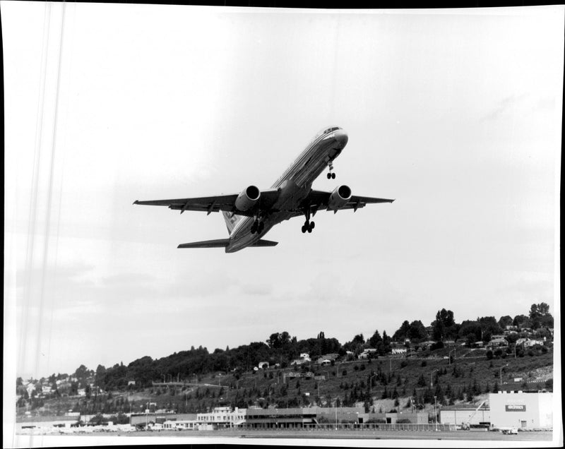 A Boeing 757 takes off and aims at their destination. - Vintage Photograph