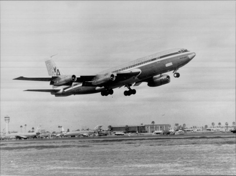 A Boeing 707 lifts toward an unknown destination. - Vintage Photograph