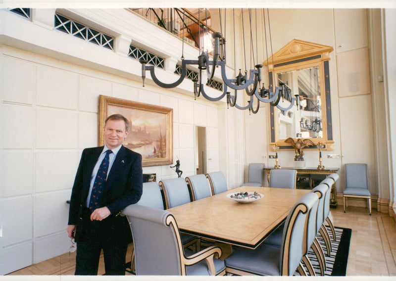 Jeffrey Archer in that part of his penthouse that is the dining room. - Vintage Photograph