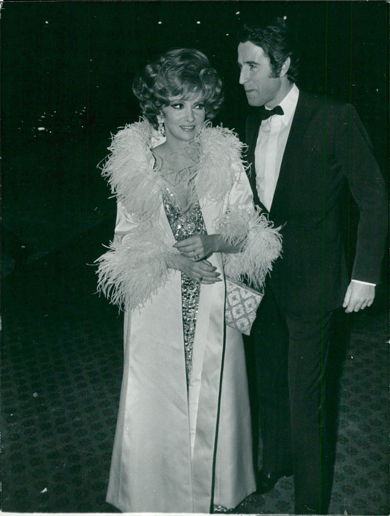 Gina Lollobrigida and Jacques Chazot arrive at the theater - Vintage Photograph