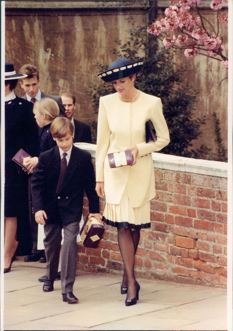 Princess Diana and her son, Prince William, wear easter eggs as they received at the annual royal gathering for Easter celebration. - Vintage Photograph